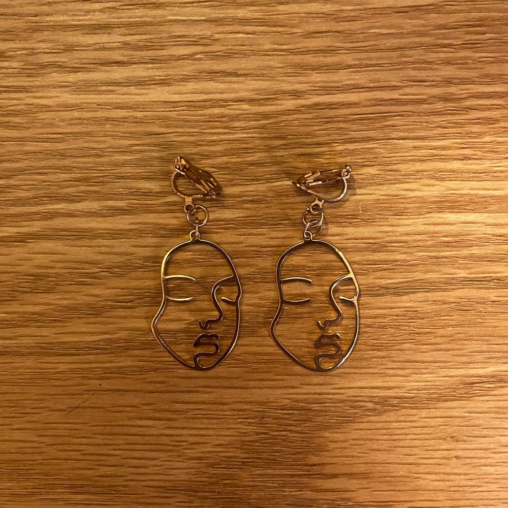 Abstract face clip on earrings
